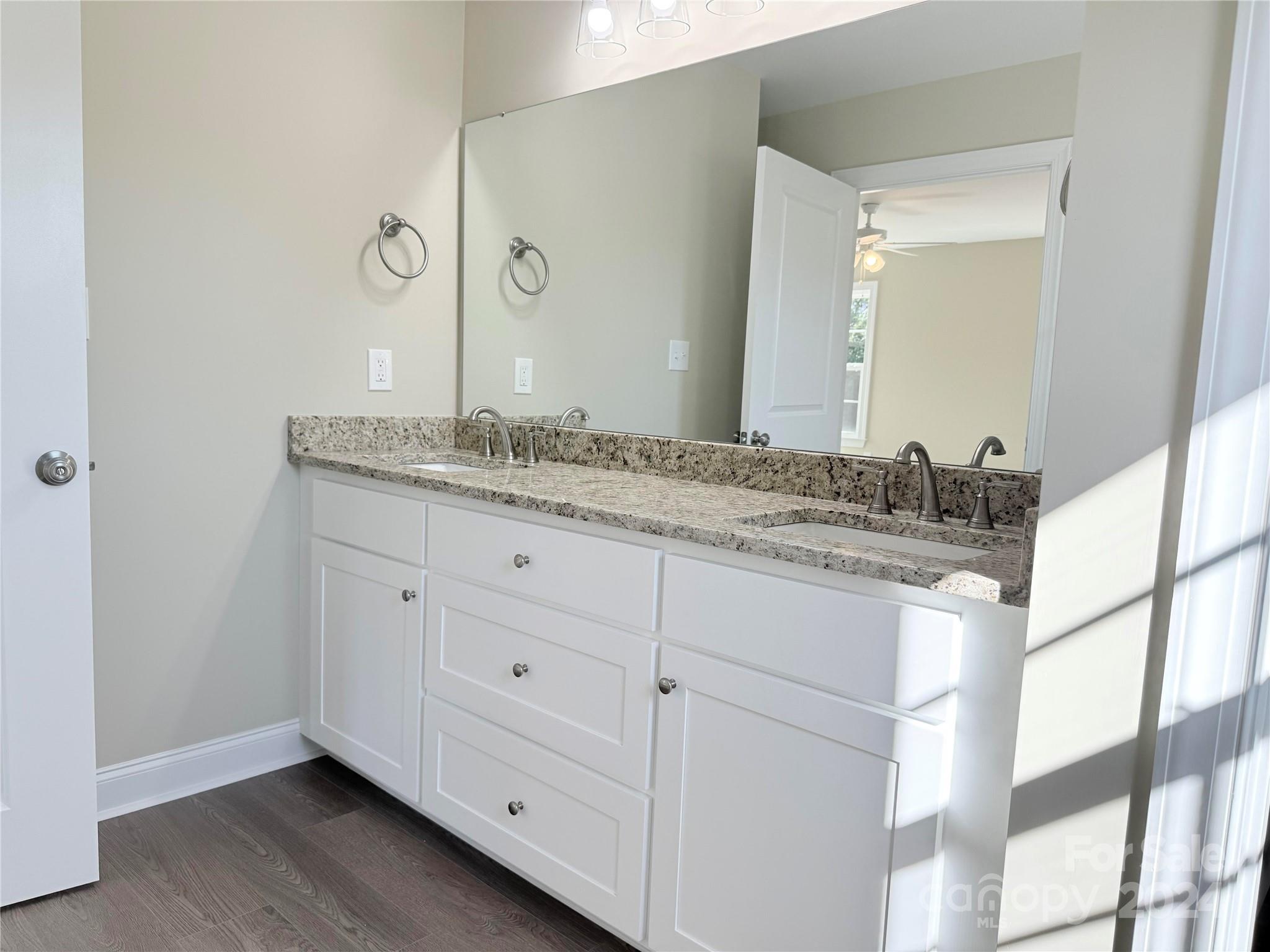 2438-j B J B Denton Road Lancaster, SC 29720 - Photo 14 of 23 a bathroom with a granite countertop sink and a mirror