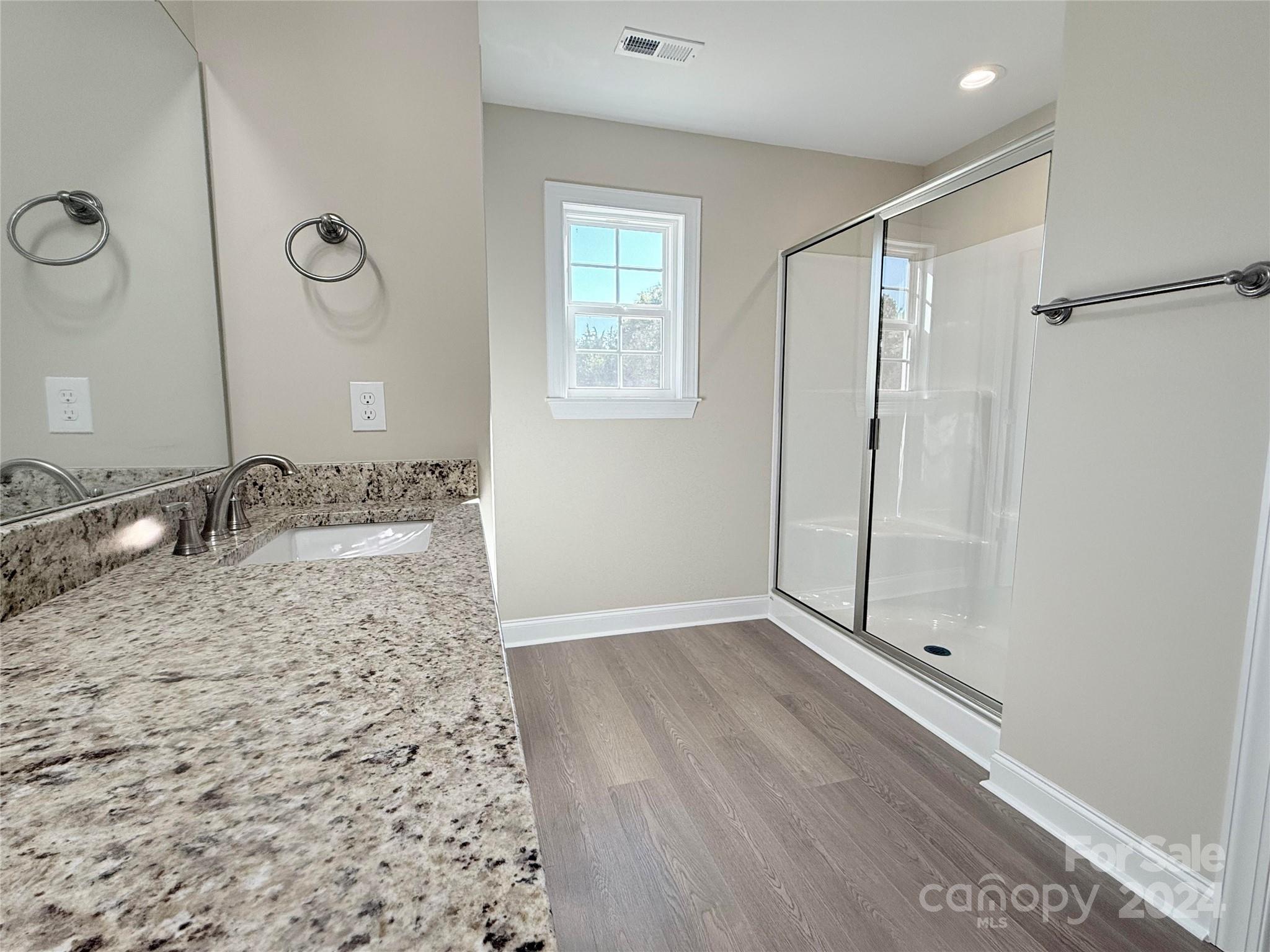 2438-j B J B Denton Road Lancaster, SC 29720 - Photo 15 of 23 a bathroom with a granite countertop sink a shower and a mirror