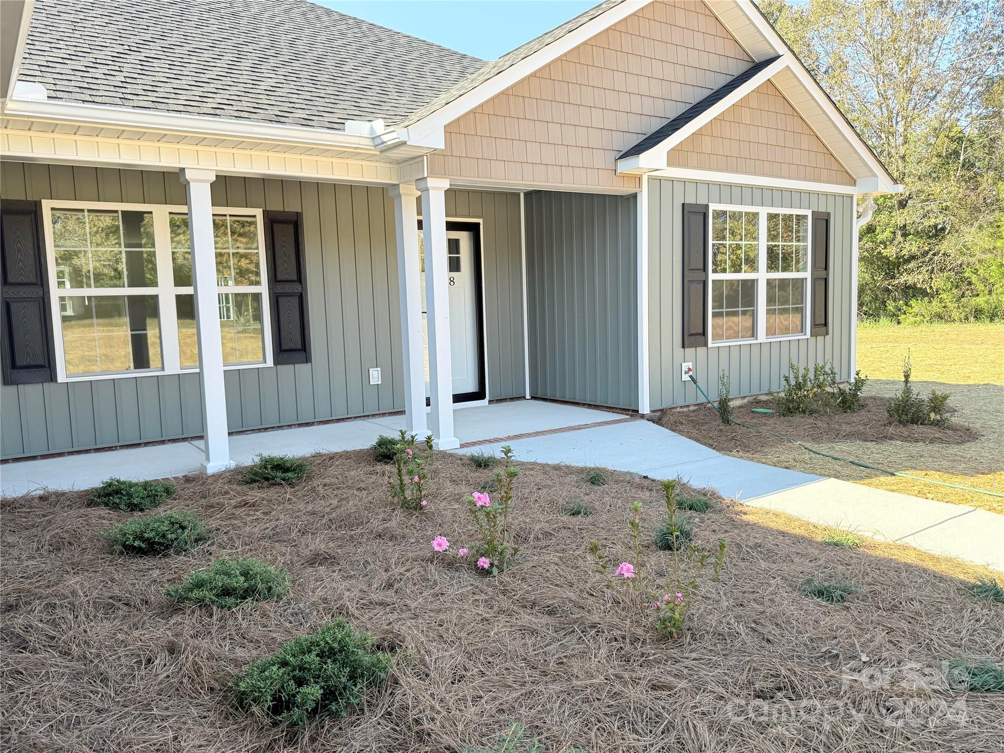 2438-j B J B Denton Road Lancaster, SC 29720 - Photo 2 of 23 a front view of a house with garden
