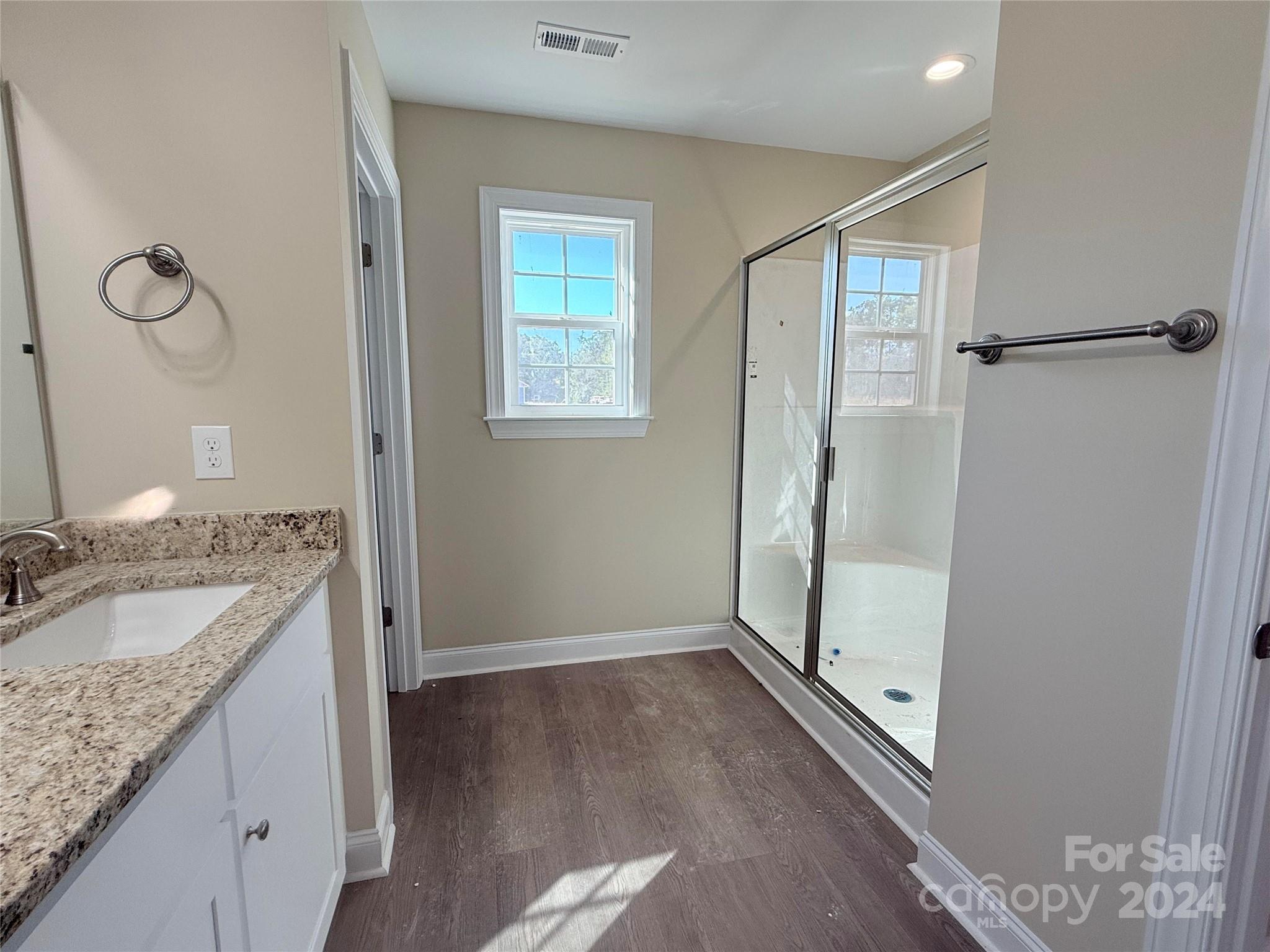 2438-j B J B Denton Road Lancaster, SC 29720 - Photo 6 of 23 a bathroom with a granite countertop sink a mirror and shower