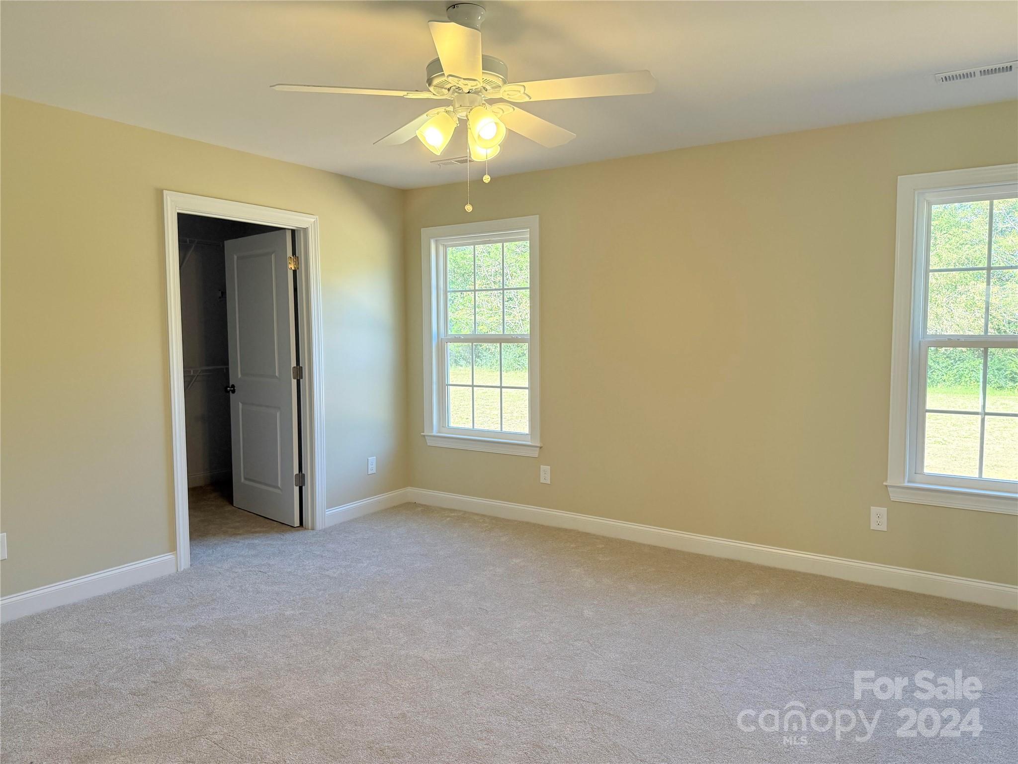2438-j B J B Denton Road Lancaster, SC 29720 - Photo 9 of 23 an empty room with windows and fan