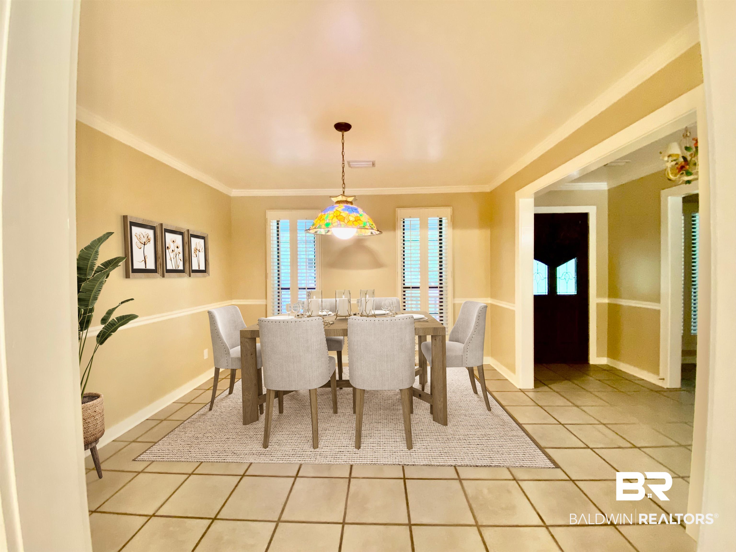 160 Mockingbird Lane Monroeville, AL 36460 - Photo 8 of 36 Dining room with light tile patterned flooring and crown molding