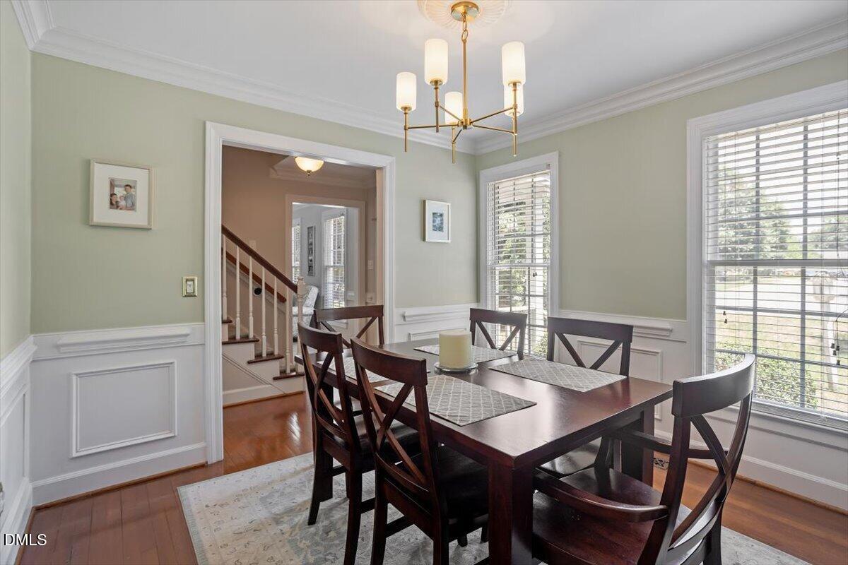 1808 Thorpshire Drive Raleigh, NC 27615 - Photo 7 of 17 a view of a dining room with furniture window and wooden floor