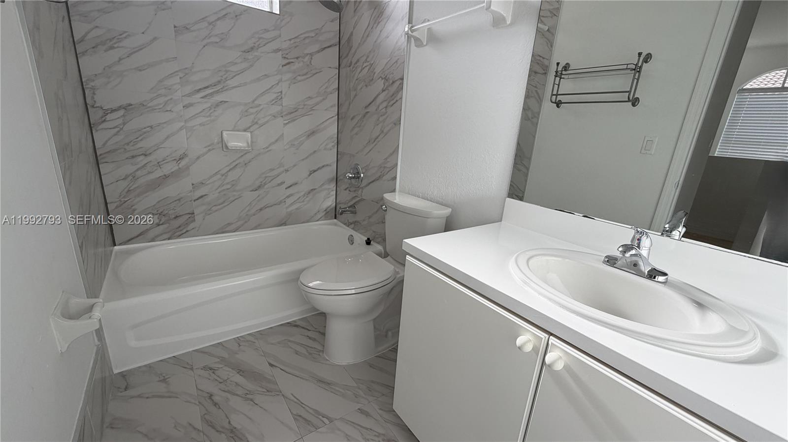 12260 Southwest 123rd Pass Miami, FL 33186 - Photo 11 of 14 a bathroom with a sink toilet and shower