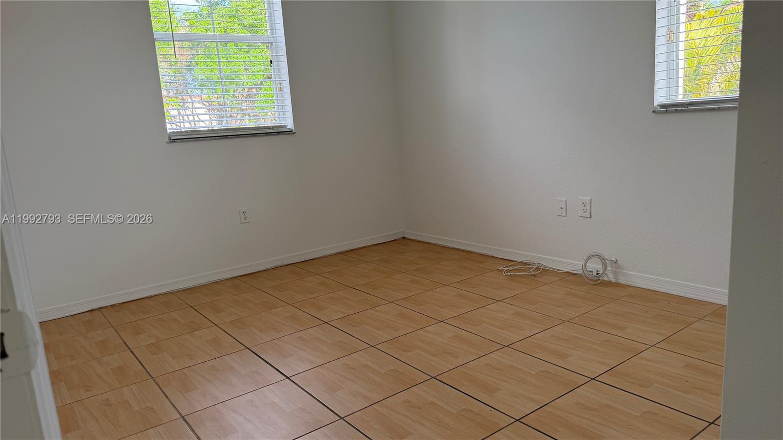 12260 Southwest 123rd Pass Miami, FL 33186 - Photo 12 of 14 an empty room with windows