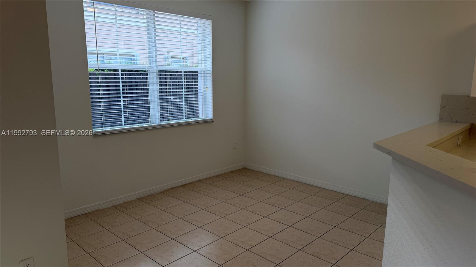 12260 Southwest 123rd Pass Miami, FL 33186 - Photo 3 of 14 a view of an empty room with a window