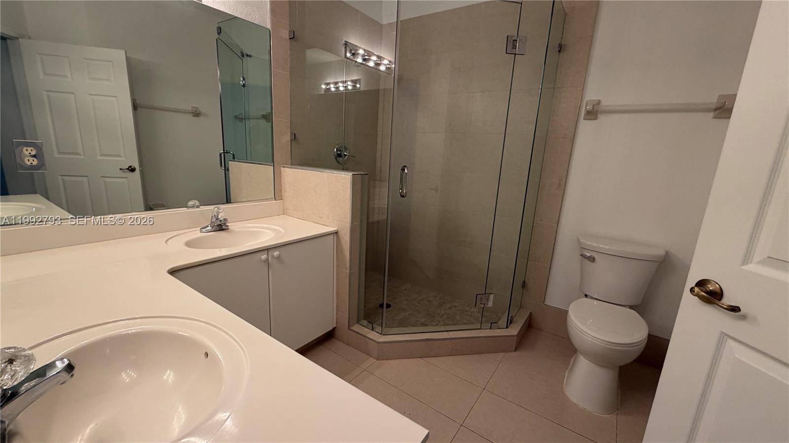 12260 Southwest 123rd Pass Miami, FL 33186 - Photo 7 of 14 a bathroom with a sink a toilet and shower
