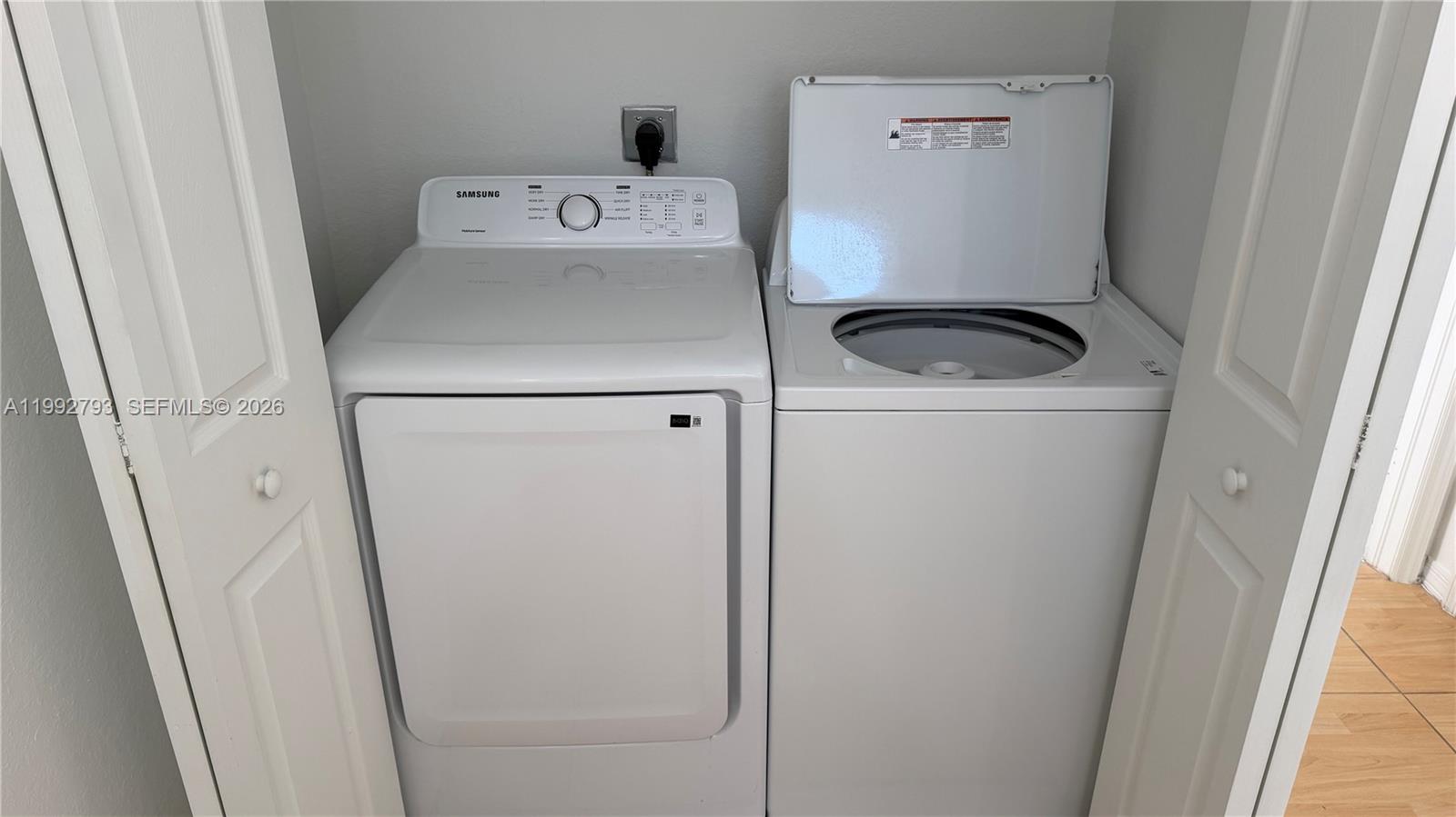 12260 Southwest 123rd Pass Miami, FL 33186 - Photo 9 of 14 a utility room with dryer and washer
