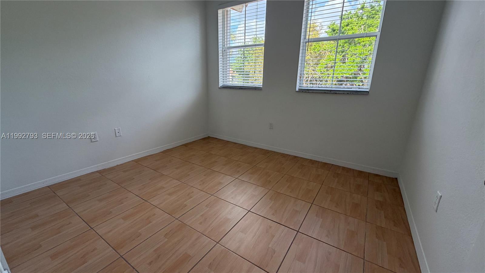 12260 Southwest 123rd Pass Miami, FL 33186 - Photo 10 of 14 an empty room with a window