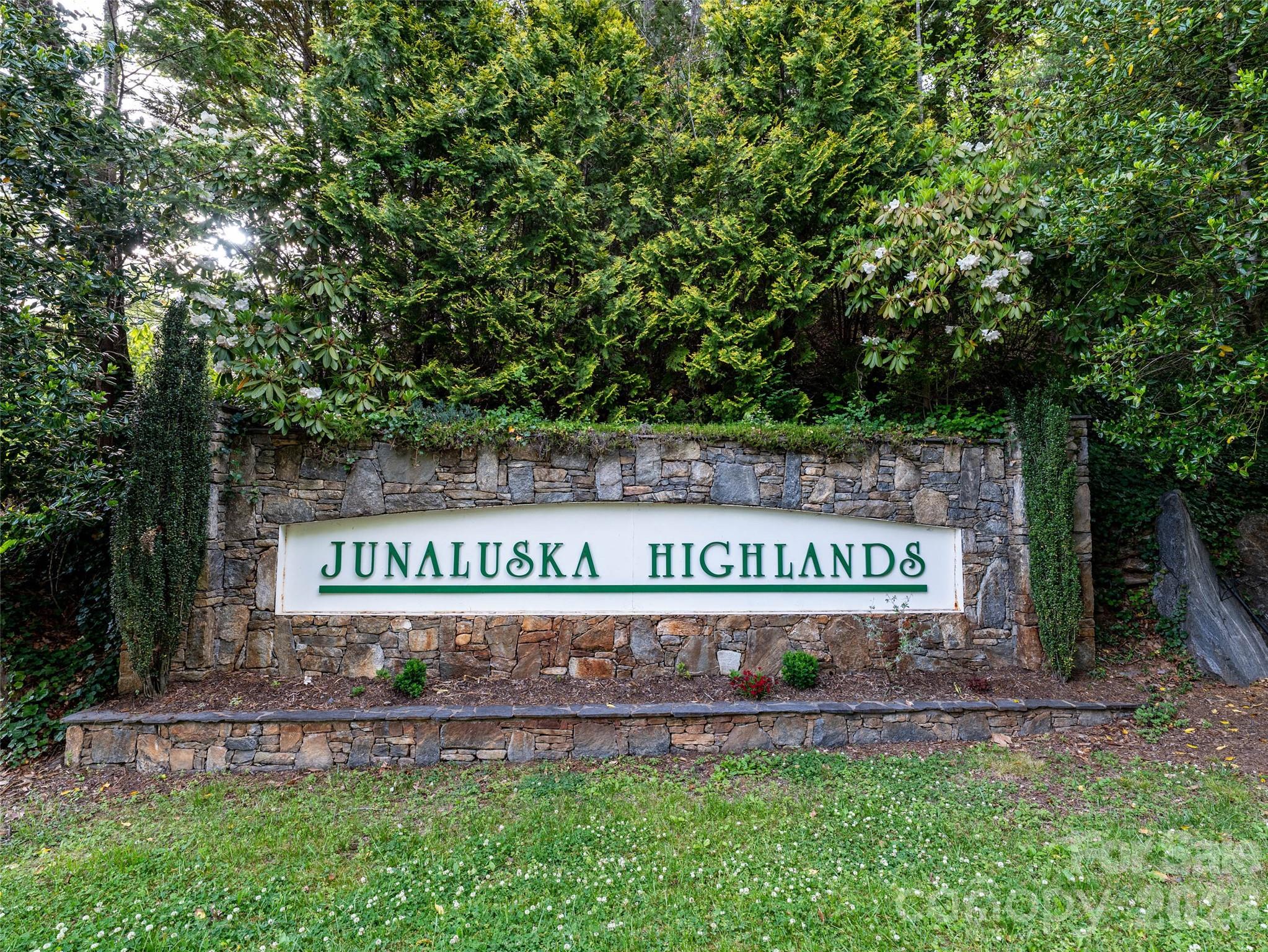 Lot 13 Breckenridge Road Waynesville, NC 28785 - Photo 6 of 13 a sign that is sitting on a brick wall
