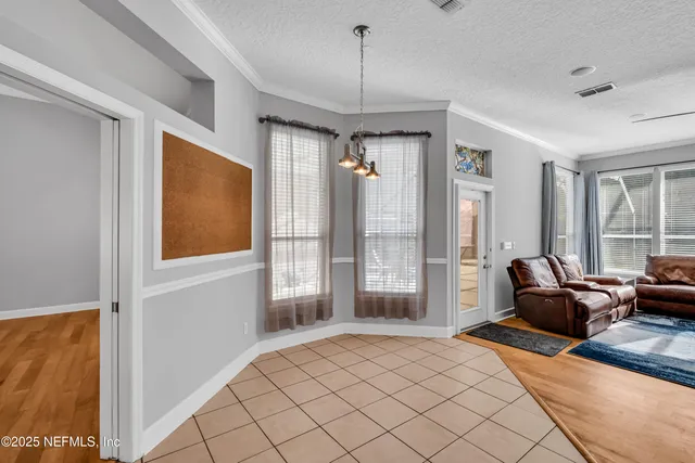 an aerial view of multiple houses with yard