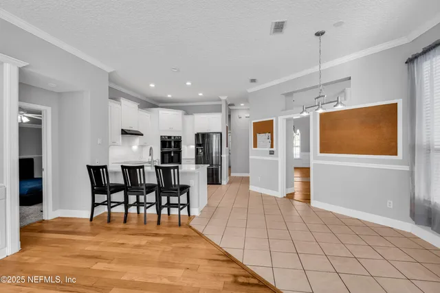 a front view of a house with a garden and yard