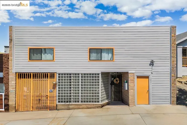 a view of a brick house with a large window