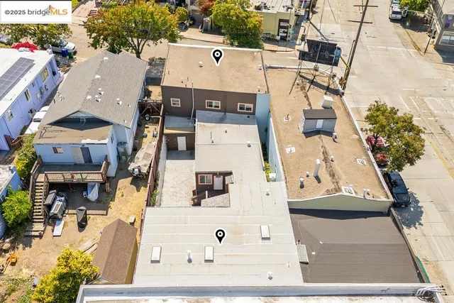 an aerial view of a building with an outdoor space