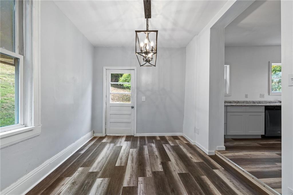 124 Silver Street Pittsburgh, PA 15209 - Photo 12 of 28 a view of a hallway view with wooden floor and staircase