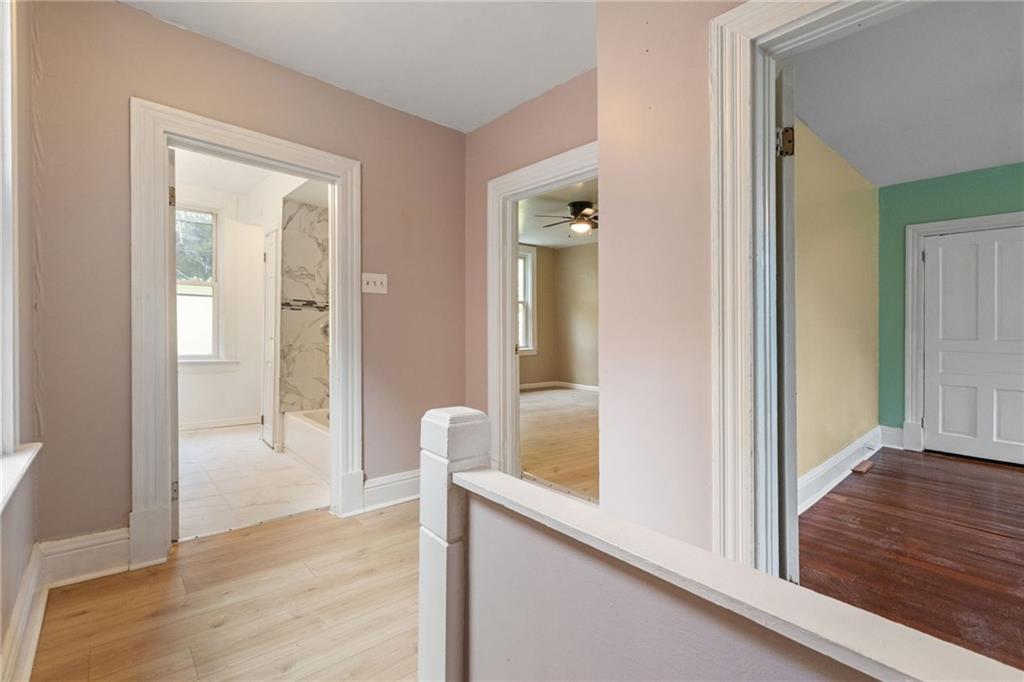 124 Silver Street Pittsburgh, PA 15209 - Photo 14 of 28 a view of a hallway with wooden floor and closet