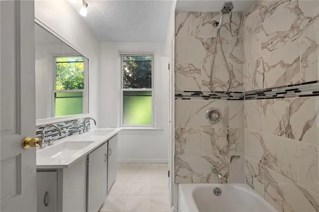 a bathroom with a sink and a bathtub