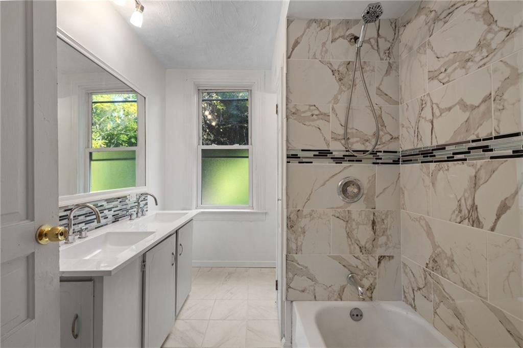 124 Silver Street Pittsburgh, PA 15209 - Photo 15 of 28 a bathroom with a sink and a bathtub