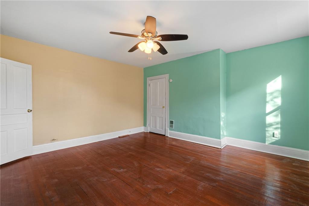124 Silver Street Pittsburgh, PA 15209 - Photo 20 of 28 a view of an empty room with window and wooden floor