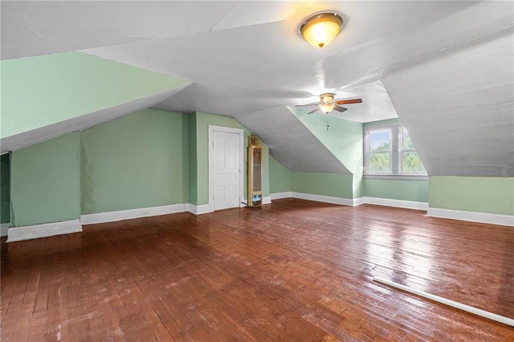124 Silver Street Pittsburgh, PA 15209 - Photo 21 of 28 a view of a room with a ceiling fan and window