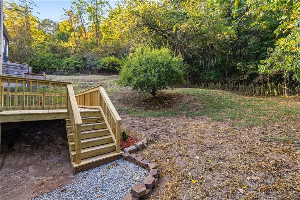 124 Silver Street Pittsburgh, PA 15209 - Photo 25 of 28 a view of a yard with lawn chairs and a barbeque