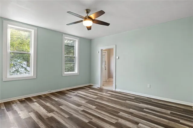 a view of room with window and ceiling fan