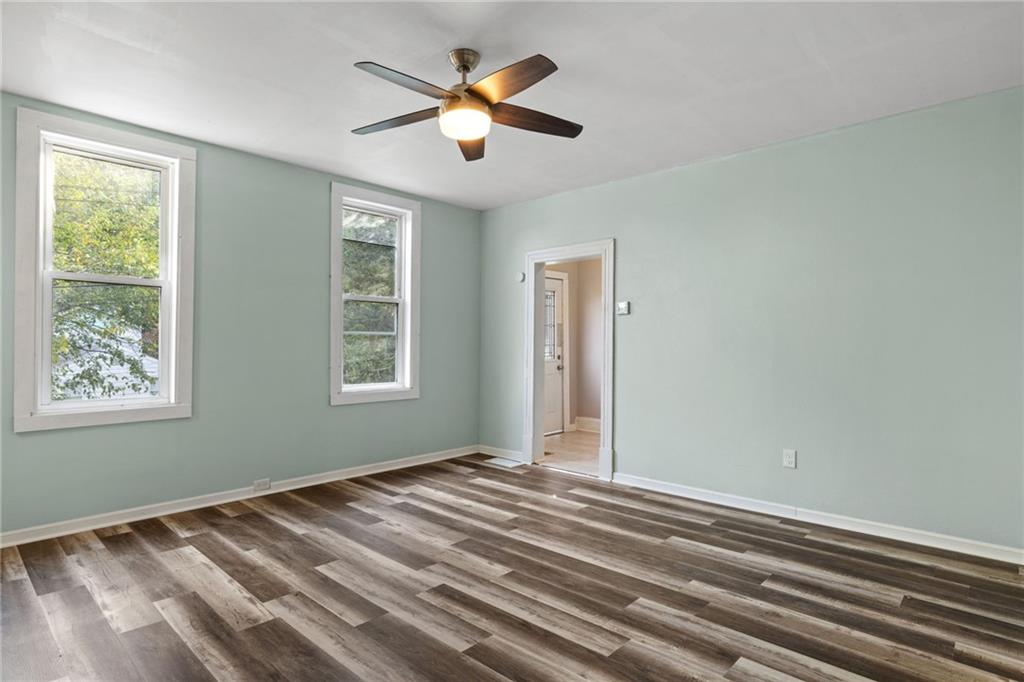 124 Silver Street Pittsburgh, PA 15209 - Photo 6 of 28 a view of room with window and ceiling fan