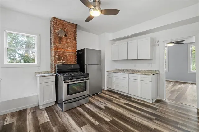 a kitchen with a stove oven and sink