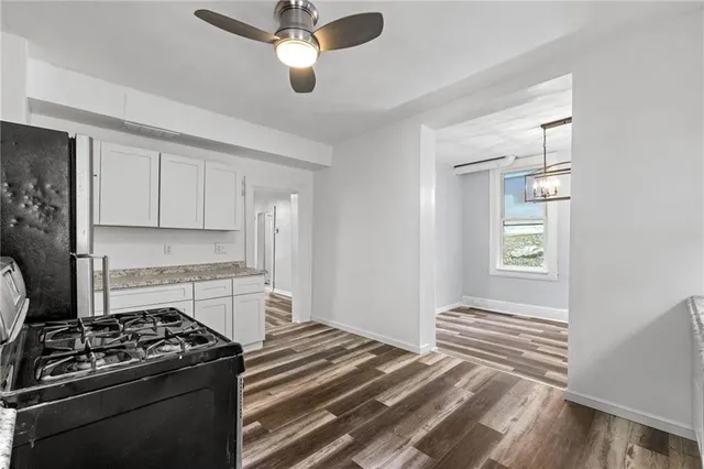 a kitchen with a stove and a refrigerator