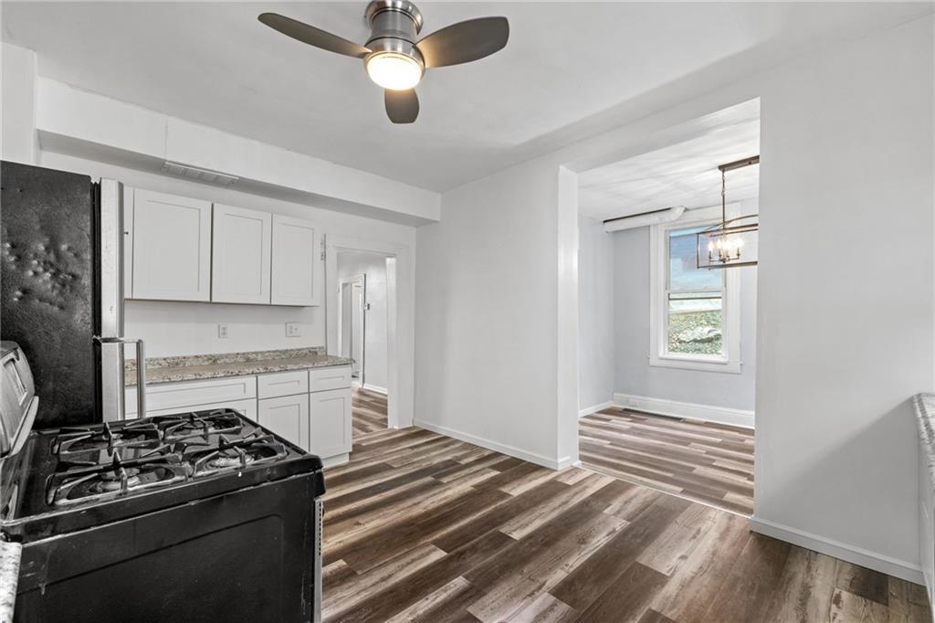 124 Silver Street Pittsburgh, PA 15209 - Photo 9 of 28 a kitchen with a stove and a refrigerator