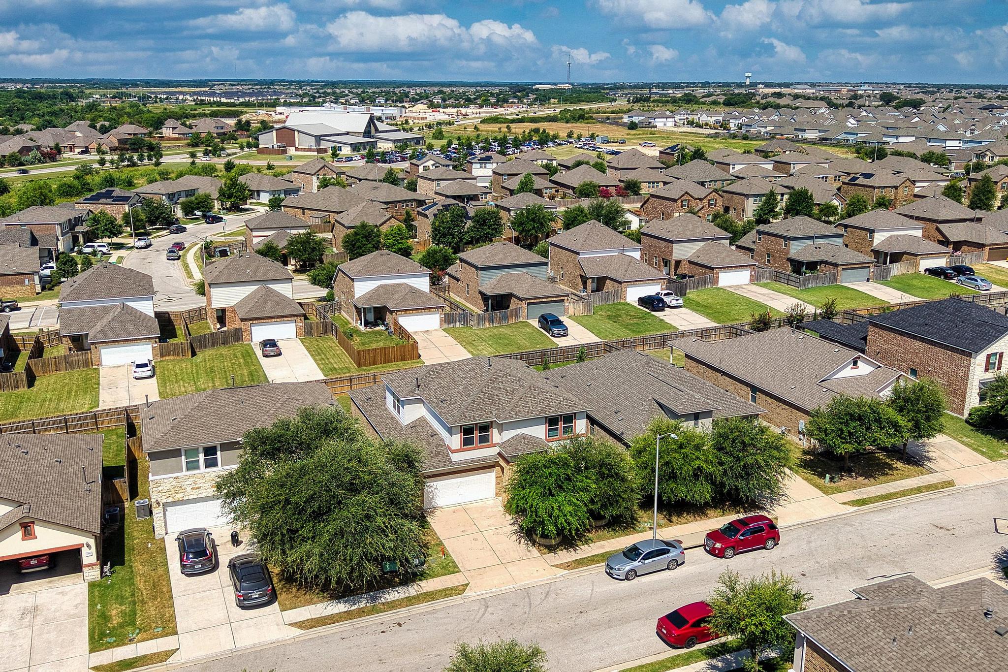 1341 Eagle Ray Street Leander, TX 78641 - Photo 29 of 37 An aerial perspective reveals a vibrant neighborhood filled with diverse residential architecture and verdant landscaping.