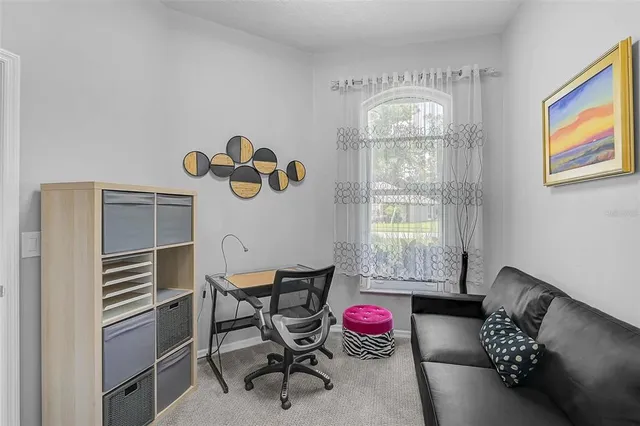 a bedroom with furniture and a window