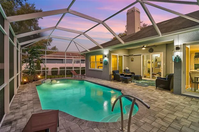 a view of a swimming pool with a patio