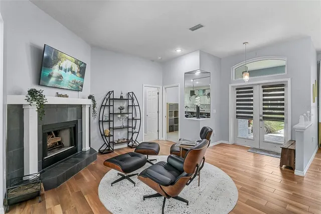 a living room with furniture and a fireplace