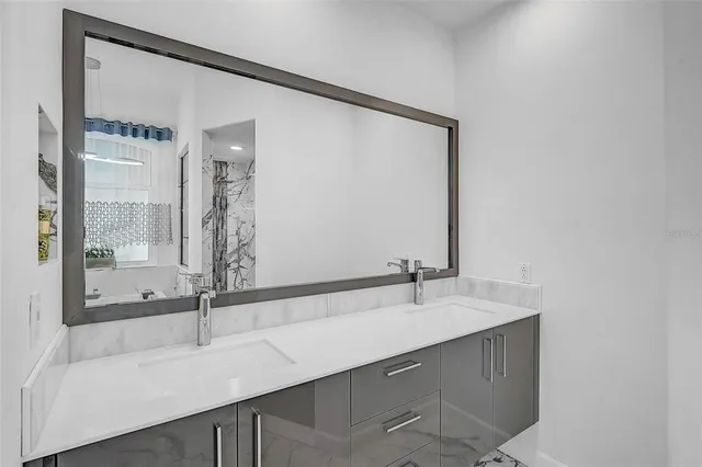 a bathroom with a sink and a mirror