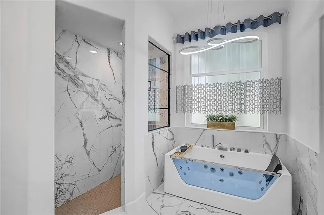 a bathroom with a bathtub and shower