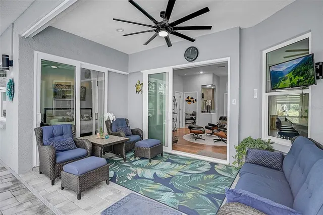 a living room with furniture and a large window