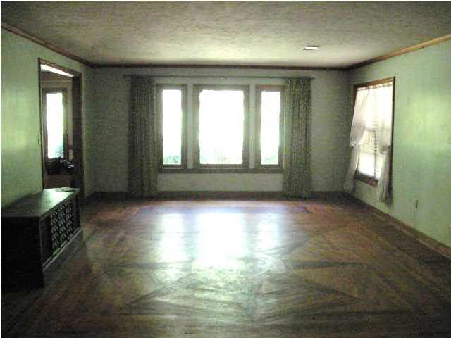 FORMAL LIVING ROOM WITH HARDWOOD FLOORS