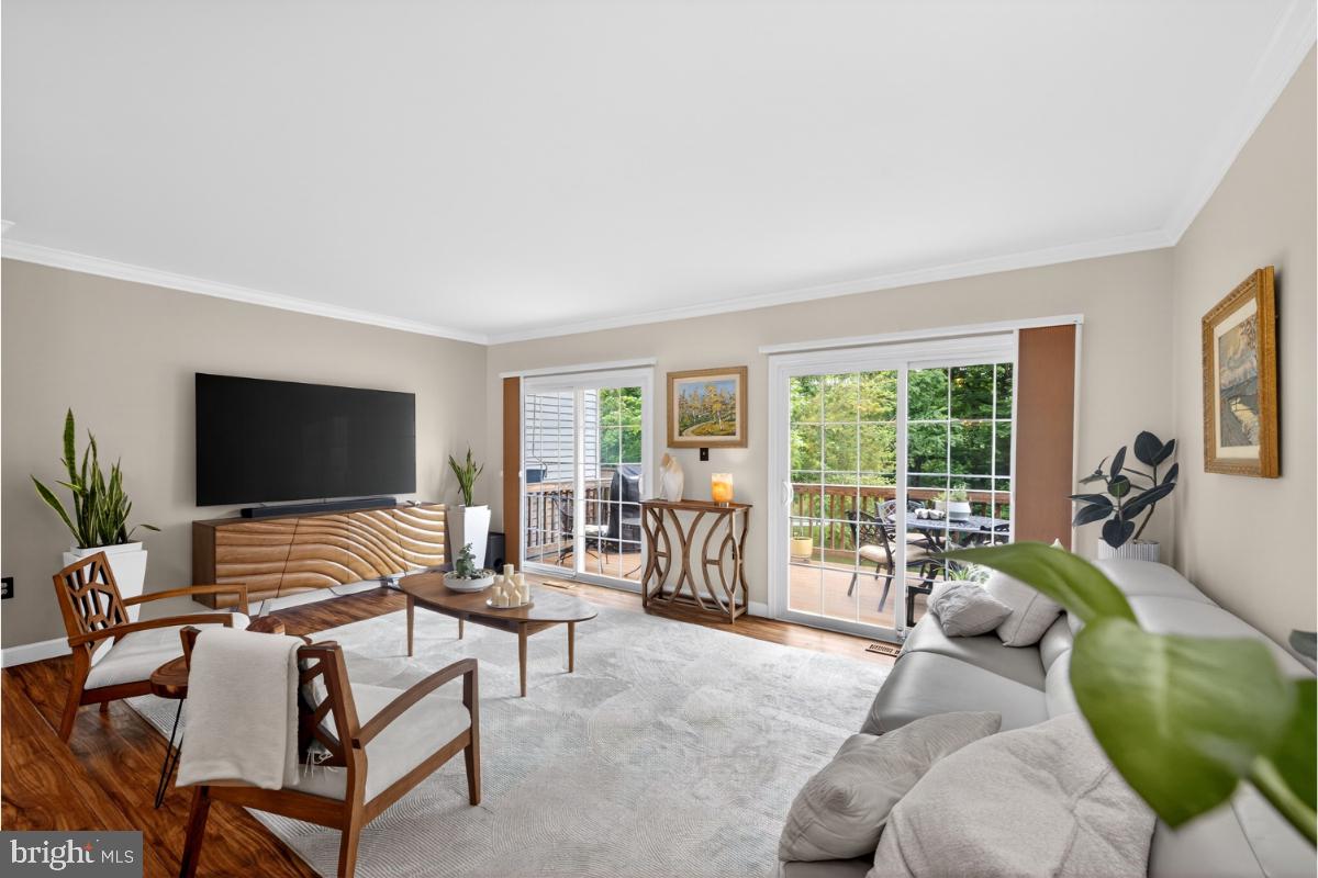 7347 Swan Point Way, Unit 122 Columbia, MD 21045 - Photo 10 of 54 a living room with furniture and a flat screen tv