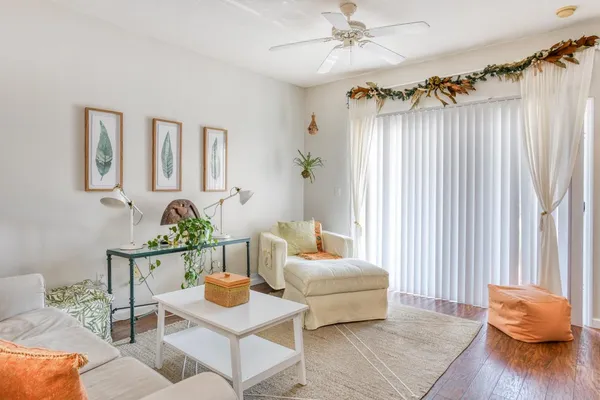 a living room with furniture and a window