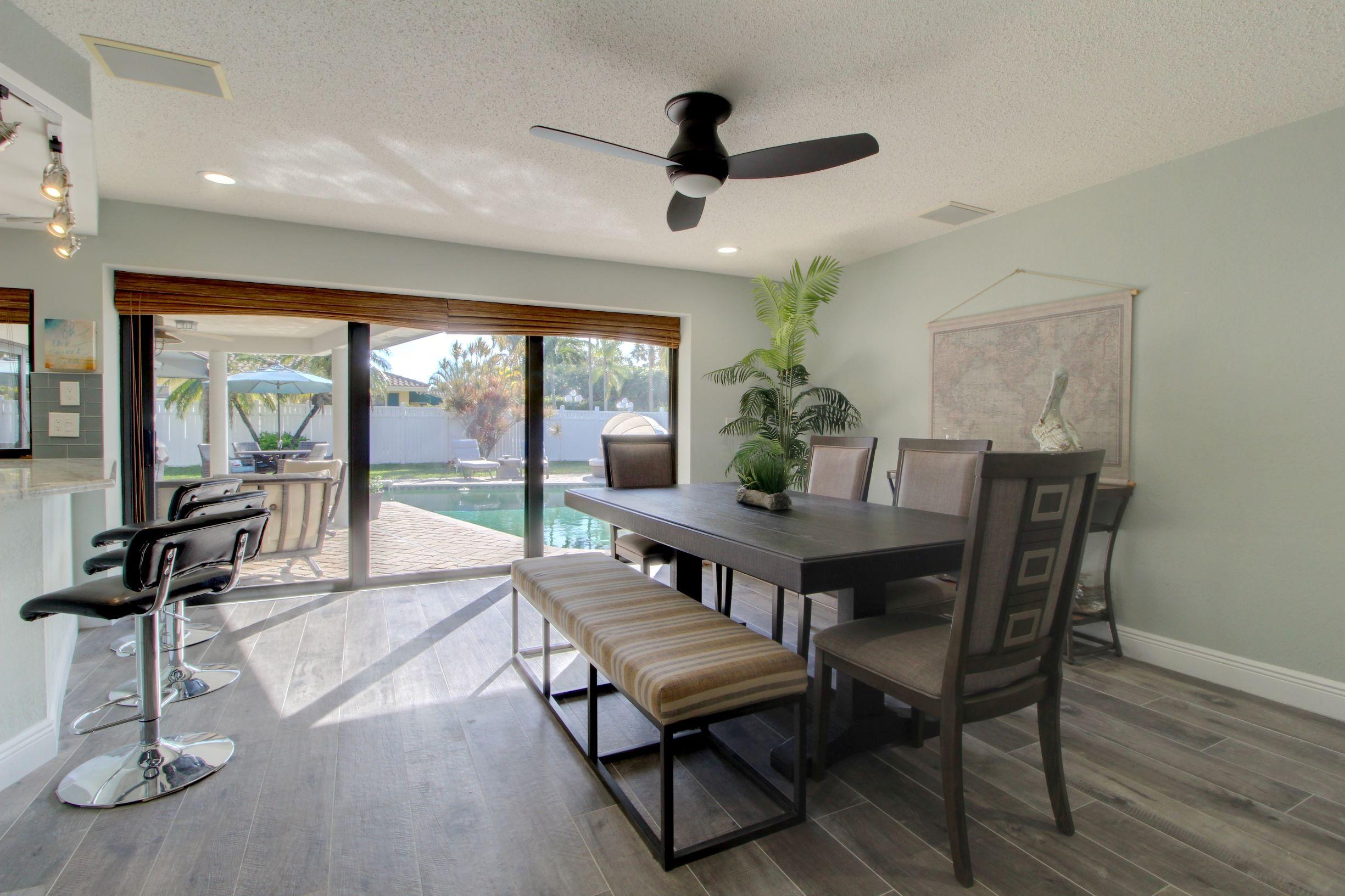 1501 Banyan Road Boca Raton, FL 33432 - Photo 16 of 26 a view of a dining room with furniture window and outside view