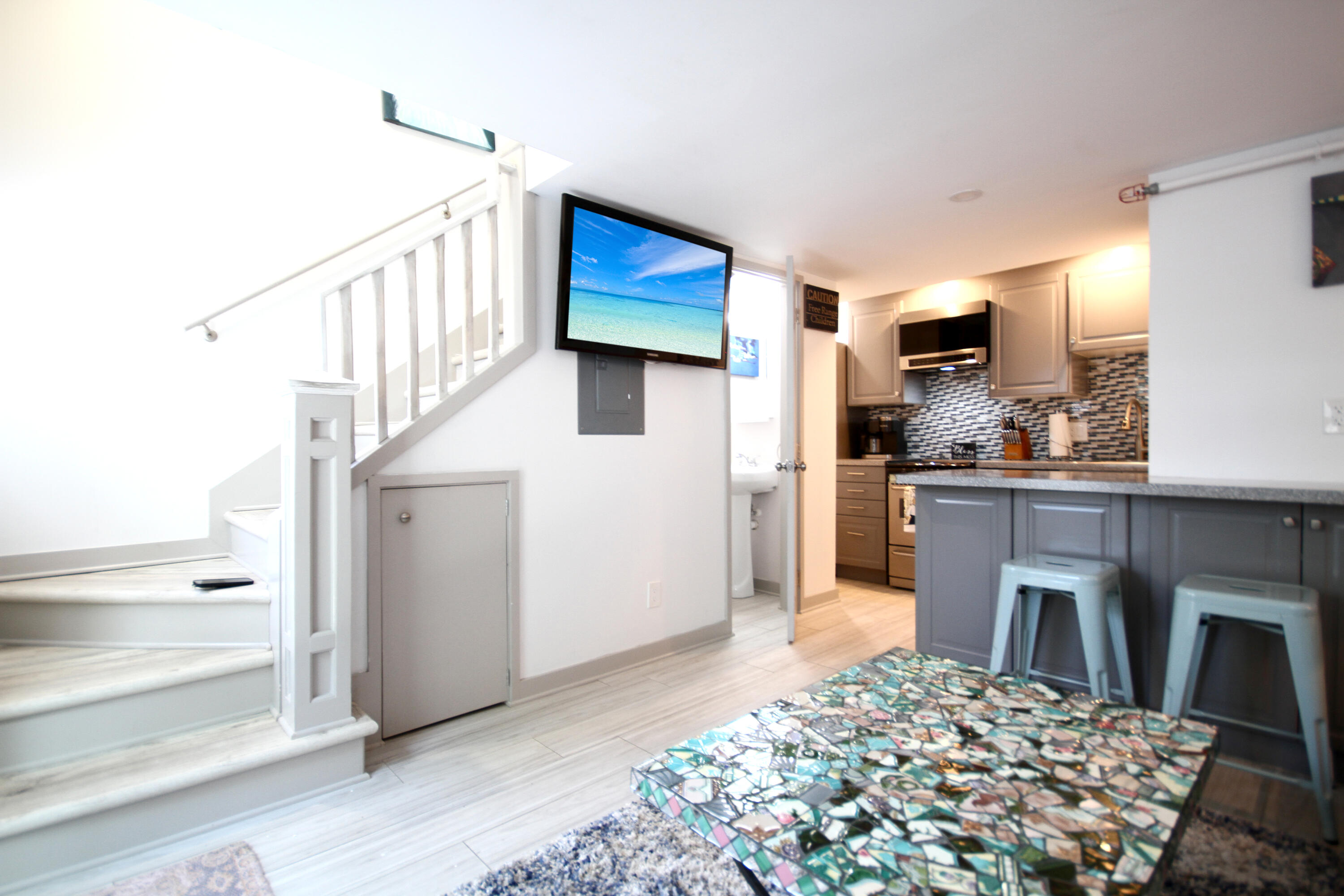 723 Eaton Street Key West, FL 33040 - Photo 76 of 90 Pied a terre living-stairs-tv