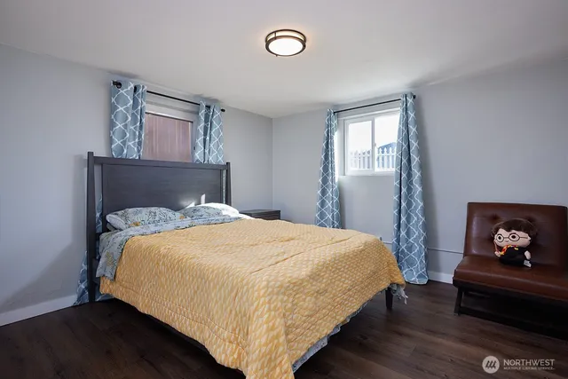 a bathroom with a sink mirror and toilet
