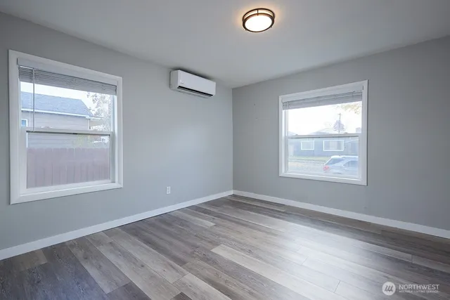 a bedroom with bed and a window