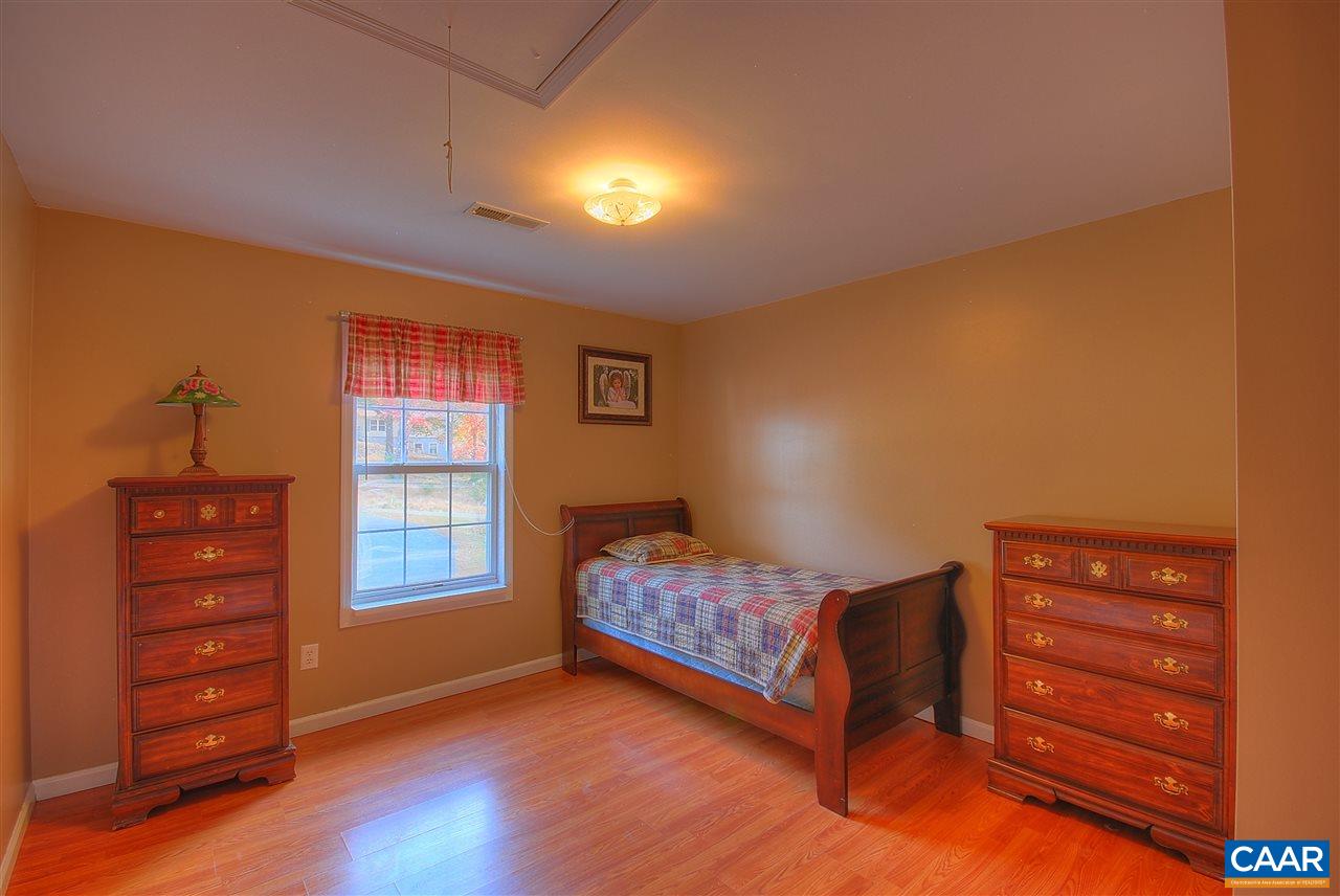 716 Jonquil Road Ruckersville, VA 22968 - Photo 14 of 21 a bedroom with a bed and a window