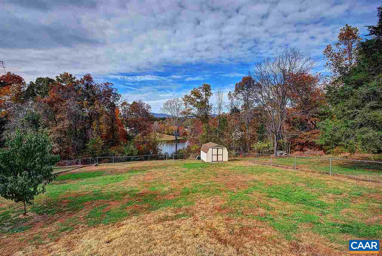 716 Jonquil Road Ruckersville, VA 22968 - Photo 17 of 21 a view of a field with a tree in front of the house