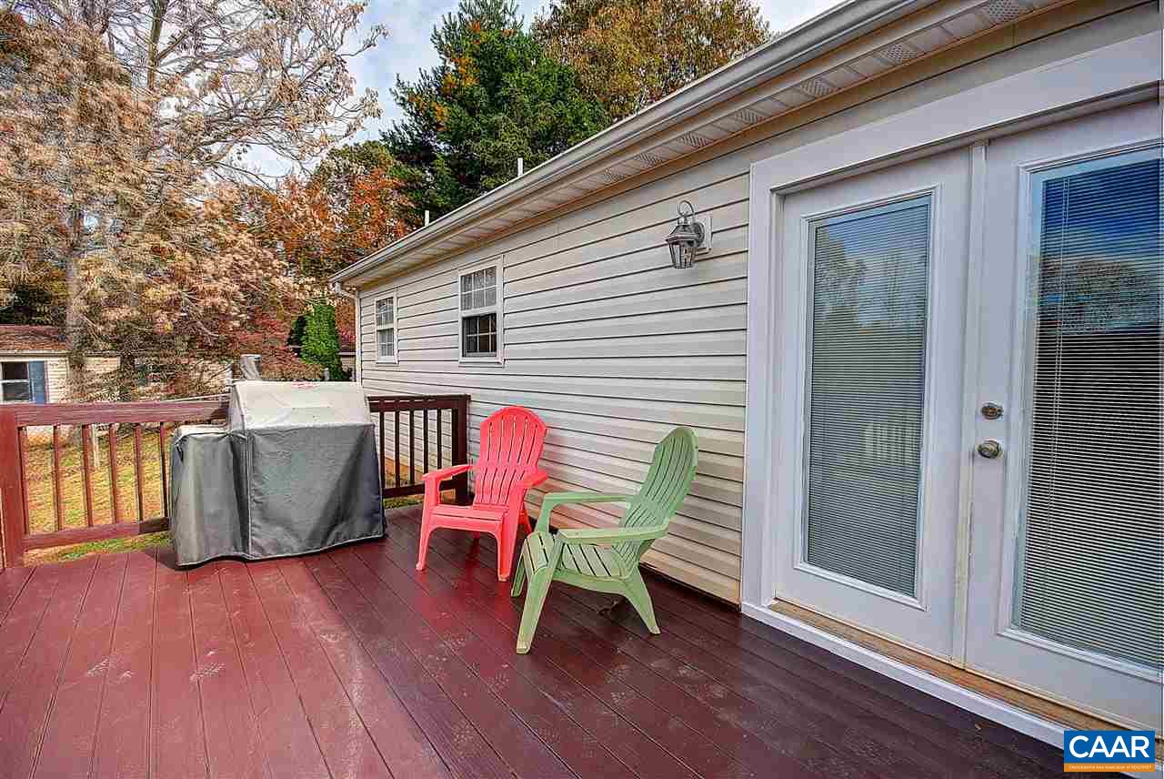 716 Jonquil Road Ruckersville, VA 22968 - Photo 20 of 21 a view of a chair and tables in the balcony