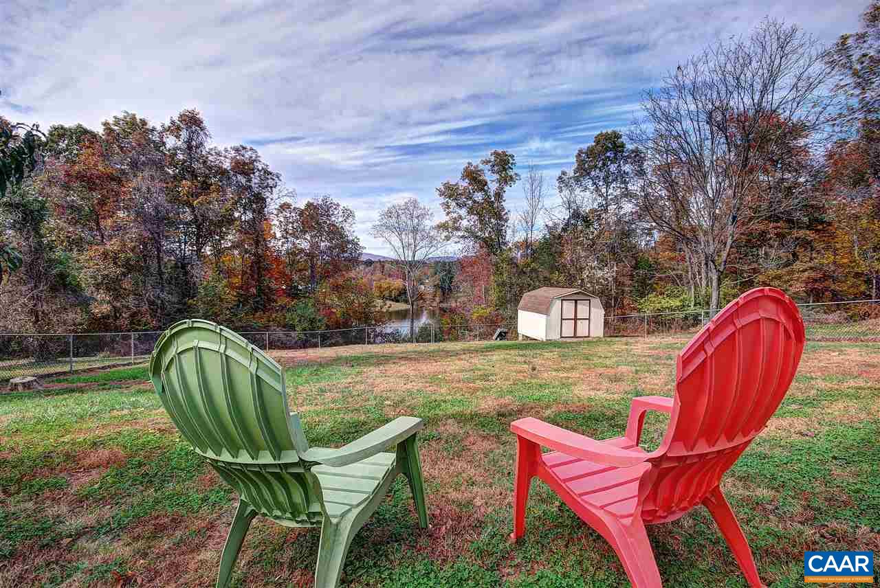 716 Jonquil Road Ruckersville, VA 22968 - Photo 2 of 21 a view of a two chairs in a backyard
