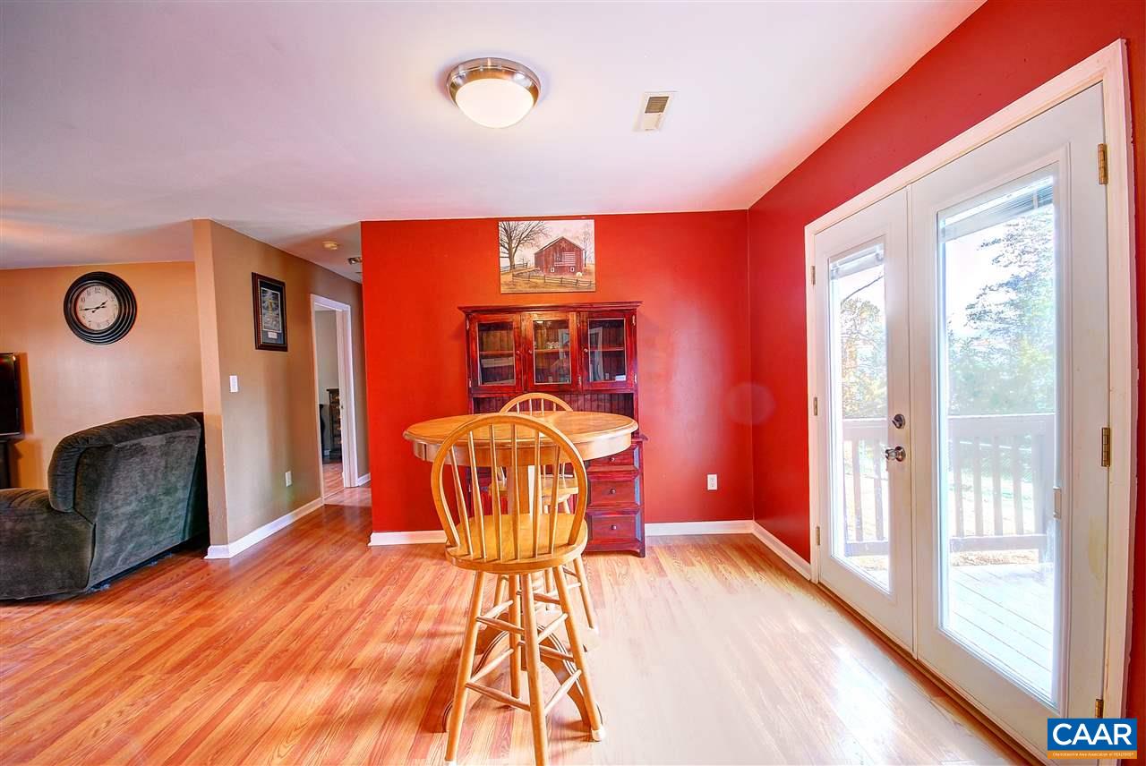 716 Jonquil Road Ruckersville, VA 22968 - Photo 5 of 21 a bedroom with a bed and wooden floor