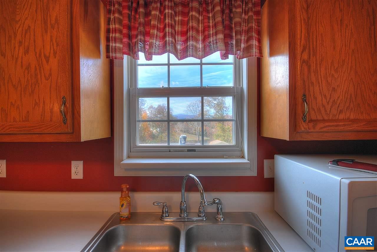 716 Jonquil Road Ruckersville, VA 22968 - Photo 7 of 21 a kitchen with a sink and a window